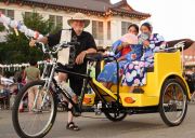 Buddhist celebration with pedicab